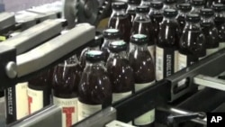 Honest Tea bottles get packaged for distribution and eventual consumer sale