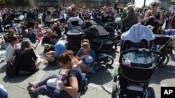 Hundreds of women promote public breastfeeding outside City Hall Square, Copenhagen, June 17, 2013.