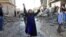 A woman reacts near the site of a car bomb attack in Kirkuk, 250 km (155 miles) north of Baghdad, November 14, 2012.