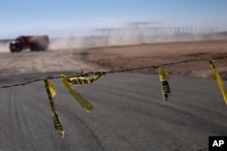 Barbed wire surrounds the site of a cancelled Ford auto manufacturing plant, one day after the U.S. auto company announced the project was called off, in Villa de Reyes, Mexico, Wednesday, Jan. 4, 2017.