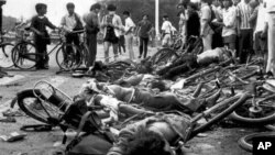 ** FILE ** The bodies of dead civilians lie among mangled bicycles near Beijing's Tiananmen Square in this June 4, 1989 file photo. A leading pro-Beijing lawmaker in Hong Kong insisted that Chinese troops did not massacre people during the bloody crackdo