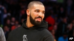 FILE - Drake attends an NBA game. 