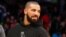 FILE - Drake attends an NBA game. 