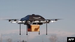 This undated handout photo released by Amazon on December 1, 2013 shows a flying "octocopter" mini-drone that would be used to fly small packages to consumers. 