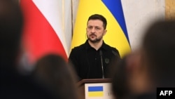 Ukraine's President Volodymyr Zelenskyy looks on during a joint press conference with Poland's prime minister in Lviv, on Dec. 17, 2024.