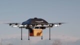 Amazon CEO Jeff Bezos reveals a flying &quot;octocopter&quot; mini-drone that will be used to fly small packages to consumers. His company was looking to the future with plans to use mini-drones to deliver small packages.