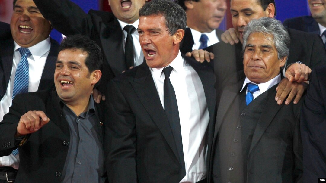 Actor Antonio Banderas, center, is pictured with Alex Vega, right, and Mario Gomez, two of the 33 workers trapped in a Chilean mine in 2010, at a preview of "The 33" in Santiago, Chile, August 2, 2015.