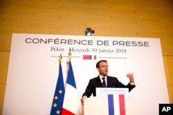 French President Emmanuel Macron speaks at a press conference at the French Embassy in Beijing, Wednesday, Jan. 10, 2018.