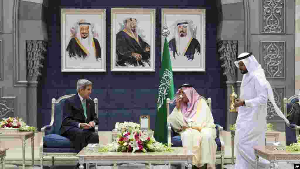 U.S. Secretary of State John Kerry, left, attends a coffee ceremony with Saudi Foreign Minister Prince Saud al-Faisal as a welcome upon Kerry's arrival in Jeddah, Saudi Arabia, June 25, 2013.