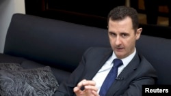 Syria's President Bashar al-Assad speaks during an interview with a German newspaper in Damascus, in this handout photograph distributed by Syria's national news agency SANA, Jun. 17, 2013.