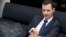Syria's President Bashar al-Assad speaks during an interview with a German newspaper in Damascus, in this handout photograph distributed by Syria's national news agency SANA, Jun. 17, 2013.