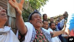 Unidentified relatives mourning the killing of Ethiopian Christians in Libya by ISIS. 04-20-15