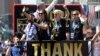 Carli Lloyd (left), Megan Rapinoe (center) and head coach Jill Ellis (right) make their way up Broadway in a ticker tape parade to celebrate their Women's World Cup championship, July 10, 2015. (Robert Deutsch-USA TODAY Sports)