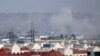 Smoke rises from explosion outside the airport in Kabul, Afghanistan, Thursday, Aug. 26, 2021.