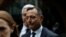 Douglas Hodge, the former chief executive of the investment firm Pimco, leaves the federal courthouse after being sentenced in connection with a nationwide college admissions cheating scheme, in Boston, Mass., Feb. 7, 2020.