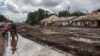 FILE — Streets in Katesh, Tanzania, are covered with mud following landslides and flooding triggered by heavy rainfall, Dec. 5, 2023.