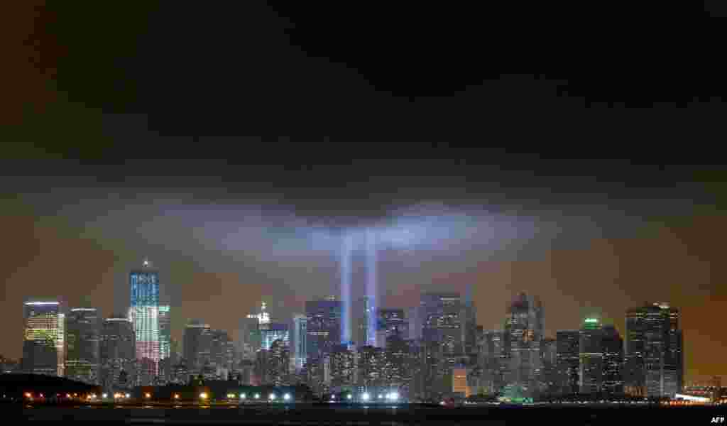 September 11: The Tribute in Lights is illuminated next to One World Trade Center in New York. REUTERS/Gary Hershorn