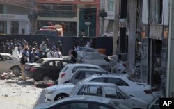 FILE - Police cordon off the area of explosion in Lahore, Pakistan, Feb. 23, 2017.