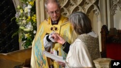 FILE - New Archbishop of Canterbury, Justin Welby, attends his enthronement ceremony at Canterbury Cathedral, southern England, March 21, 2013.