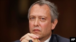 FILE - Thomas Alvin Farr is seen during a Senate Judiciary Committee hearing on his nomination to be a District Judge on the United States District Court for the Eastern District of North Carolina, on Capitol Hill, Sept. 20, 2017, in Washington. 