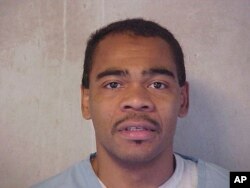 This July 8, 2004 photo of Patrick Dwayne Murphy was provided by the Oklahoma Department of Corrections. The Supreme Court is now hearing Oklahoma's plea to reinstate his murder conviction and death sentence.