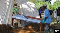 FILE - Doctors Without Borders (MSF) staff set up a cholera treatment field camp in Longo, 15 km from Bangui, Central African Republic, Aug. 16, 2016. 