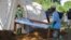 FILE - Doctors Without Borders (MSF) staff set up a cholera treatment field camp in Longo, 15 km from Bangui, Central African Republic, Aug. 16, 2016. 