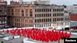 Contemporary New York artist Spencer Tunick is seen photographing nude Melburnians for his latest piece, "Return of the Nude," as part of Chapel St, Prahran's Provocare festival, in Melbourne, Australia, July 9, 2018. 
