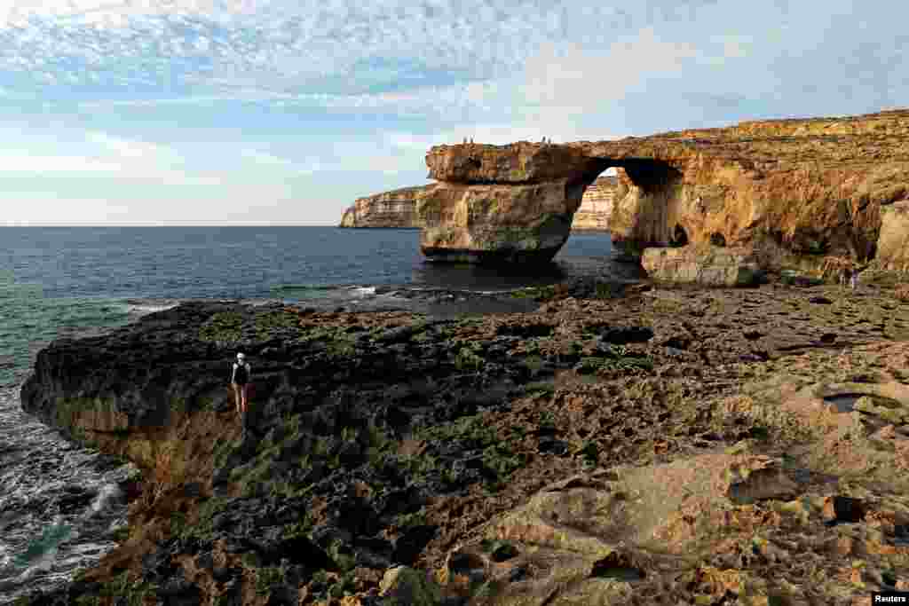 Azure Window, a 50-meter high rock arch, at Dwejra Point cliffs on the west coast of the Maltese island of Gozo