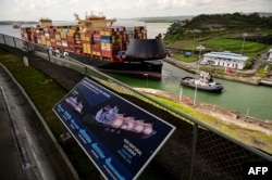 Liberian flagged MSC Gabon cargo ship is towed at the Panama Canal's Agua Clara locks on Gatun Lake in Colon, Panama on Jan. 29, 2025.