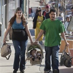 Carol and Oliver Cabrera of Omaha carry their son, Oliver Jr., in Nebraska earlier this year. The Latino population in Nebraska grew more than 70 percent in the last 10 years.