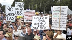 Protesters show their anger during a demonstration against the Australian Labor Governments proposed carbon tax outside Parliament House, Canberra, Australia, March 23, 2011