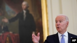 President Joe Biden responds to a question after announcing from the White House in Washington, July 29, 2021, that millions of federal workers must show proof they've received a coronavirus vaccine or submit to regular testing and masking.