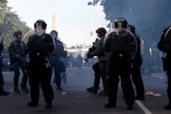 Police clear demonstrators from Lafayette Park as they protest the death of George Floyd, Monday, June 1, 2020, in Washington. Floyd died after being restrained by Minneapolis police officers. (AP Photo/Alex Brandon)