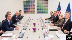 NATO Secretary General Jens Stoltenberg, right, talks with U.S Secretary of Defense Ash Carter, left, prior to a meeting of the North Atlantic Council Defense Ministers session at NATO headquarters in Brussels, Oct. 26, 2016. NATO defense ministers met to discuss tense relations with Russia, plus other issues.