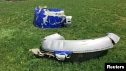 This handout photo from the National Transportation Safety Board issued April 18, 2018, shows parts of the engine cowling from the Southwest Airlines plane that suffered a blown engine in midair the day before over the skies of Philadelphia.