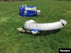 This handout photo from the National Transportation Safety Board issued April 18, 2018, shows parts of the engine cowling from the Southwest Airlines plane that suffered a blown engine in midair the day before over the skies of Philadelphia.