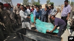 Body of slain Shiite pilgrim placed in a coffin in the holy city of Karbala, Iraq, Sept. 13, 2011 (file photo).