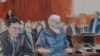 FILE -In this courtroom drawing, defense attorney, Jeremy Schneider (L) represents accused terrorist Abu Hamza al Masri (C) in Manhattan federal court in New York, October 9, 2012.