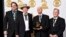 FILE - Members of the Earls of Leicester — from left, Jerry Douglas, Shawn Camp, John Warren and Charlie Cushman — pose with their award for best bluegrass album at the 57th annual Grammy Awards in Los Angeles, Feb. 8, 2015. The band has received eight International Bluegrass Music Association award nominations.
