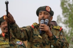 FILE - General Abdel Fattah al-Burhan, the head of Sudan's ruling military council, addresses the crowd in Khartoum's twin city of Omdurman, June 29, 2019.