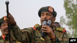 FILE - General Abdel Fattah al-Burhan, the head of Sudan's ruling military council, addresses the crowd in Khartoum's twin city of Omdurman, June 29, 2019. 