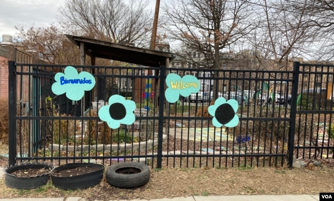 Signs welcome visitors to Girard Children's Community Garden in Washington, D.C.