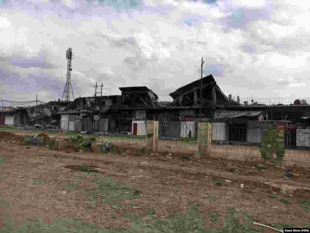 A number of shops are ruined in Karama District in Mosul.