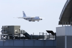 U.S. -- A Russian military transport plane carrying medical equipment, masks and supplies lands at JFK International Airport during the outbreak of the coronavirus disease (COVID-19) in New York City, New York, U.S., April 1, 2020.