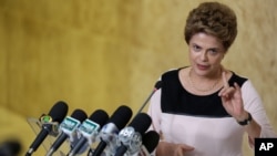 Brazil’s President Dilma Rousseff speaks with journalists after meeting with her lawyers regarding impeachment proceedings against her at Planalto presidential palace, in Brasilia, Brazil, Dec. 7, 2015.