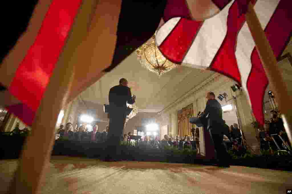 President Barack Obama and British Prime Minister David Cameron hold a joint news conference in the East Room of the White House. The president and prime minister agreed Friday to a shared effort in fighting domestic terrorism after last week&#39;s deadly attacks in France.