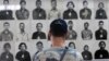 A tourist visits the Tuol Sleng Genocide Museum, also known as the notorious security prison S-21, in Phnom Penh March 3, 2015. A U.N.-backed war crimes tribunal in Cambodia on Tuesday charged two former cadres of the Khmer Rouge regime with crimes agains