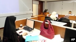 FILE - In 2011 photo, students study at the Texas A&M University located in Education City in Doha, Qatar.
