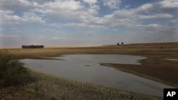 FILE - Taps and water sources have run dry in South Africa's almost dried-up local dam in Senekal, Jan. 7, 2016. 